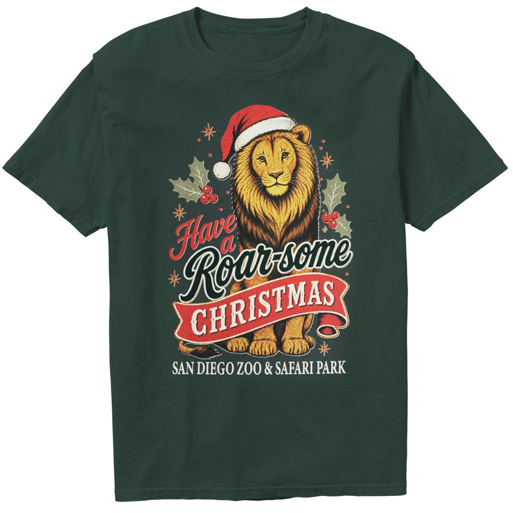 A dark forest green short-sleeve t-shirt featuring a festive graphic of a lion wearing a Santa hat, surrounded by holly leaves and the text 'Have a Roar-some Christmas' and 'SAN DIEGO ZOO & SAFARI PARK'.