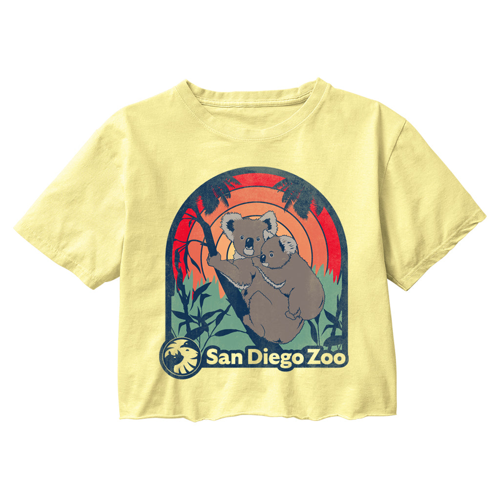 Koala Good Vibes design on a yellow cropped t-shirt with San Diego Zoo graphic featuring two koalas and a sunset design.