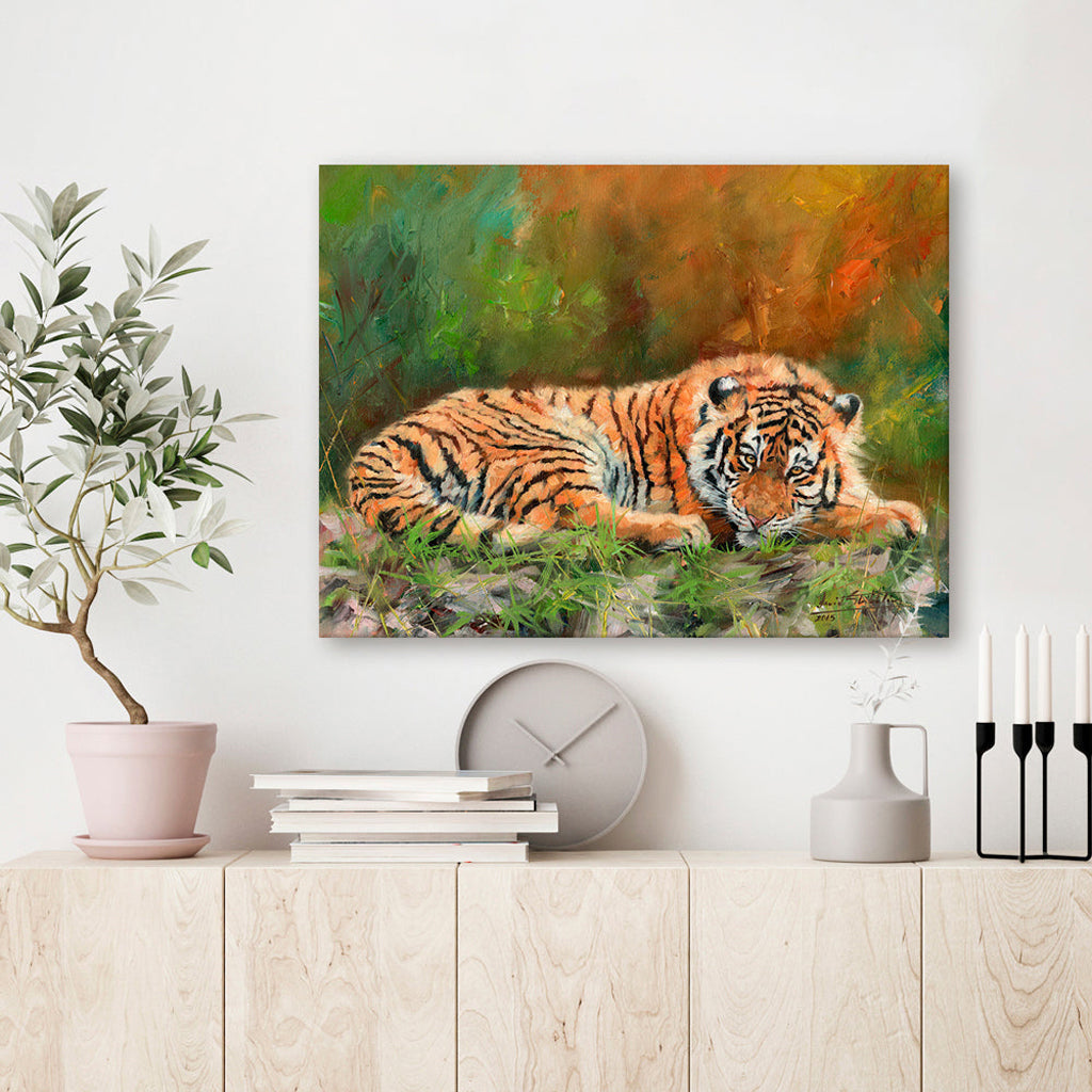 Canvas Print Painting of a tiger on a wall above a wooden shelf with decorative items.