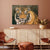 Tiger canvas print painting on a wall above a decorative cabinet with a brown chair and ottoman.
