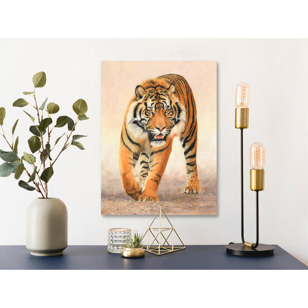 Canvas Print artwork of a tiger on a wall above a table with decorative items.