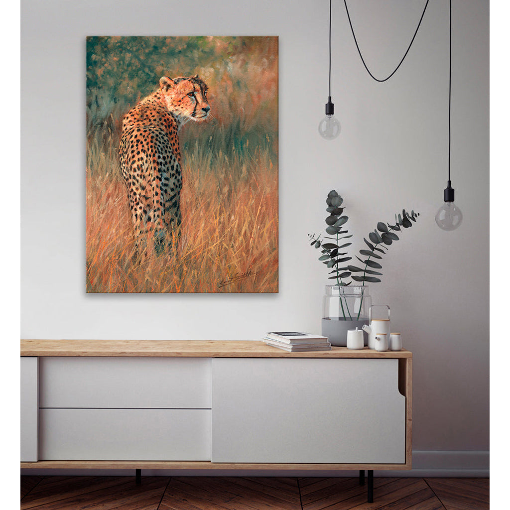 Canvas Print Cheetah painting on a wall above a wooden console table with decorative items.