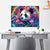 Colorful panda Canvas Print painting on a wall above a desk.