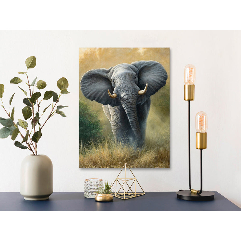 Decorative setup with an elephant Canvas Print painting, lamp, and plants on a table.