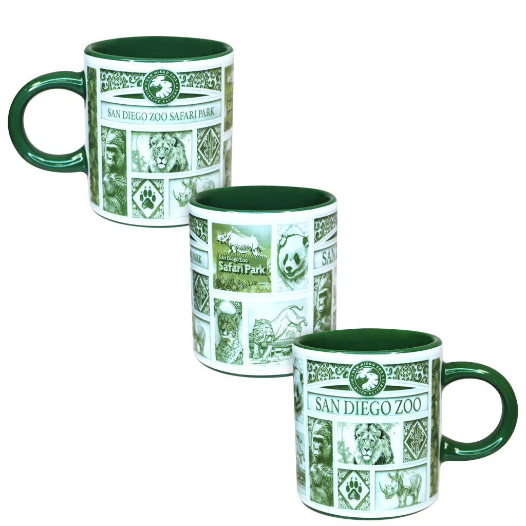 Three ceramic espresso cups with San Diego Zoo Safari Park designs, arranged diagonally on a white background. The mugs feature a green interior, green handles, and a green and white printed collage of safari animals and park imagery.