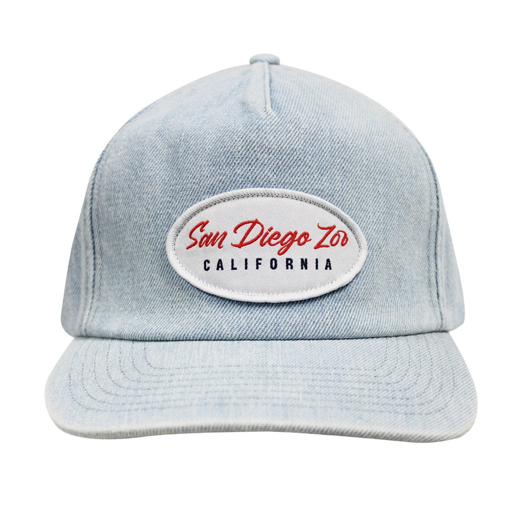 A light blue denim-style baseball cap with a curved brim and an oval embroidered patch on the front that reads 'San Diego Zoo CALIFORNIA' in red and black lettering.