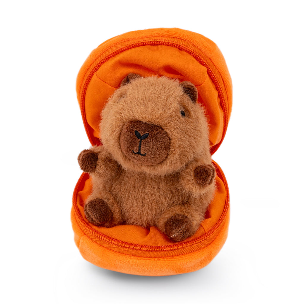 Plush capybara toy inside a pumpkin zipper pouch.