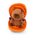 Plush capybara toy inside a pumpkin zipper pouch.