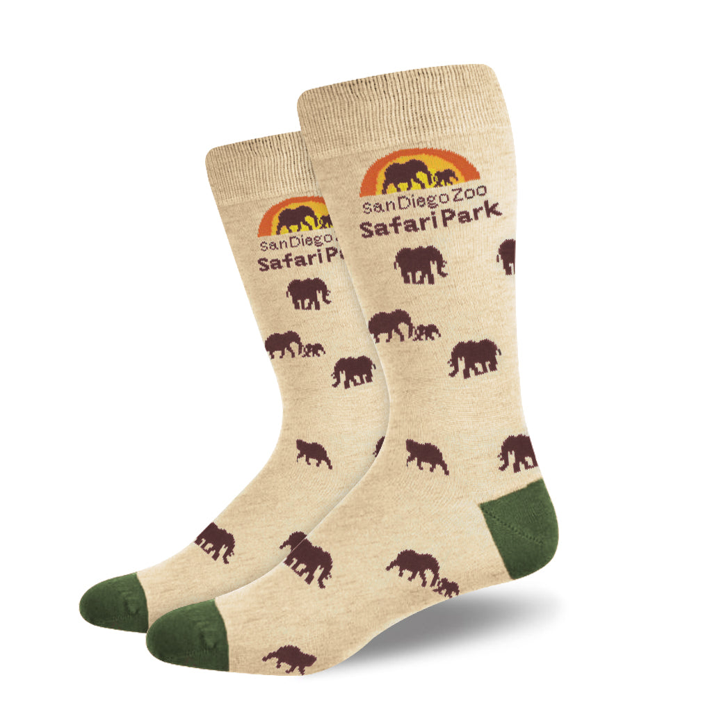 Beige socks with green heel and toe and elephant patterns and sunset design branded with 'San Diego Safari Park' text.