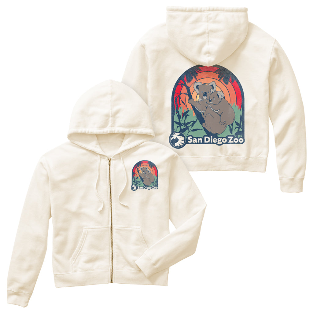 Koala Good Vibes design on an ivory mid-cropped zip-up hooded sweatshirt with San Diego Zoo graphic featuring two koalas and a sunset design.