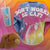 Tie-dye shirt with "DON'T WORRY BE CAPY" text, plush capybara, and tumbler on a colorful background.