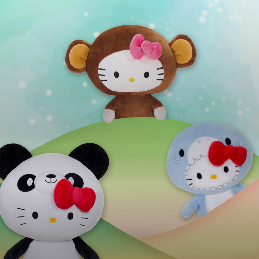 Hello Kitty wildlife plushies- a giant panda, a monkey, and a shark with bows on a light green background.
