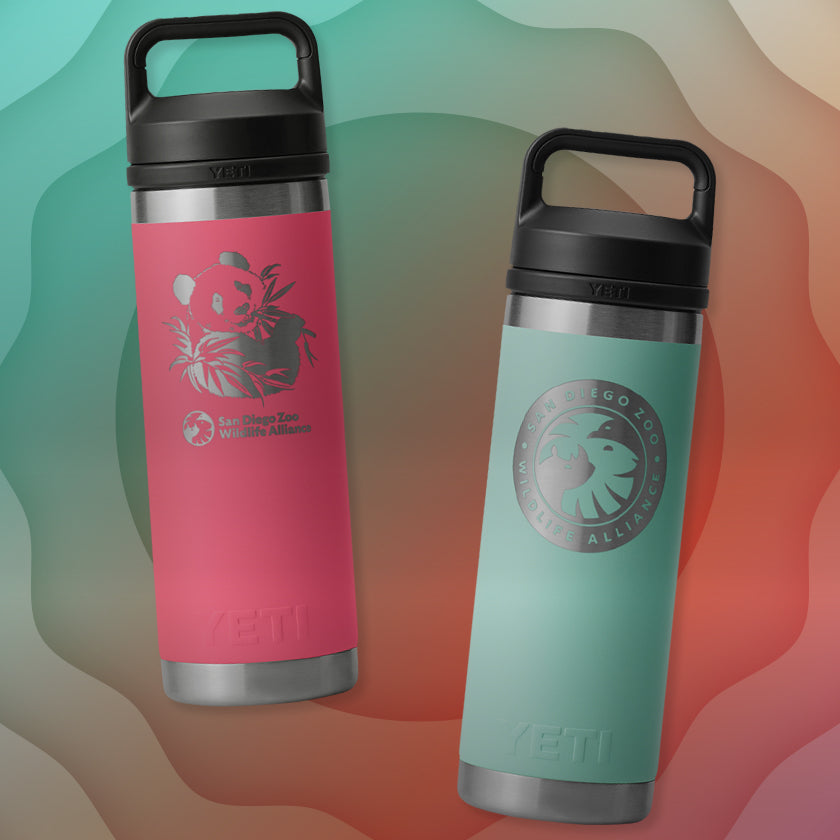 Two insulated YETI tumblers, one pink and one teal, with black lids on a colorful gradient background.