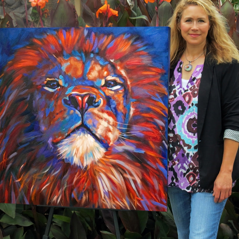 Artist, Marna Schindler, displaying her "Izu" the Lion Artwork