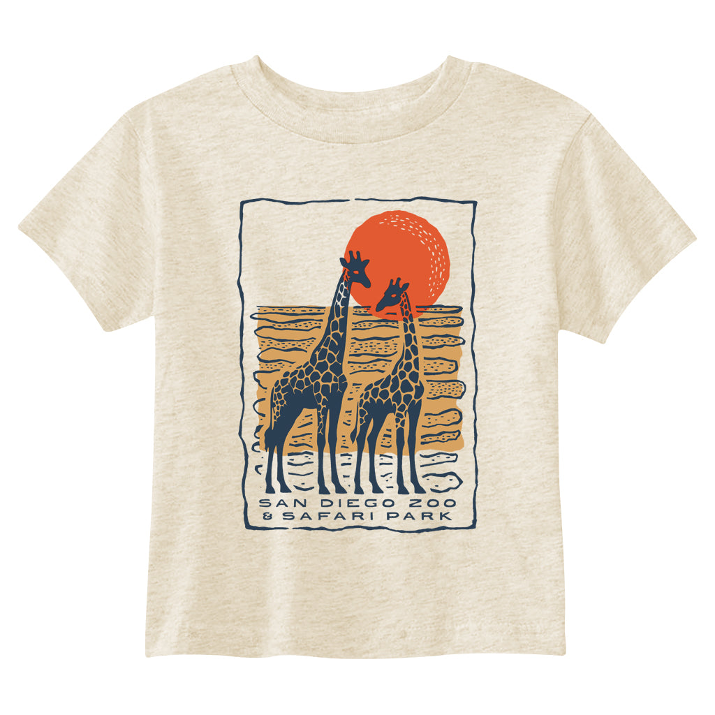 Short-sleeve crewneck toddler-fit t-shirt in a natural heather color, featuring a graphic print of two giraffes in front of a large orange sun with the text 'SAN DIEGO ZOO & SAFARI PARK'.