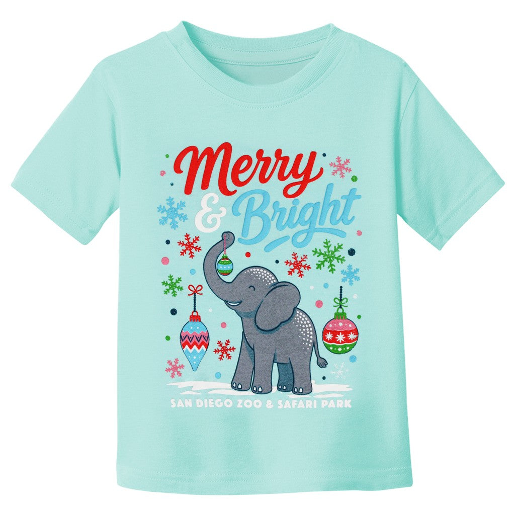 A light aqua short-sleeve kids' toddler size t-shirt featuring a festive Christmas graphic with a gray elephant, colorful ornaments, snowflakes, and the text 'Merry & Bright' and 'SAN DIEGO ZOO & SAFARI PARK'.